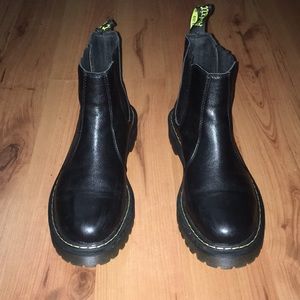 All black low cut Dr. Martens boots
